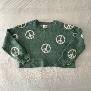 Pink Rose cropped green peace sign sweater. Medium